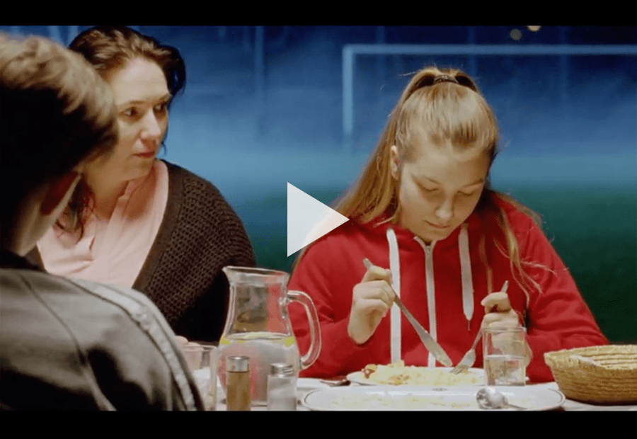 teen girl having dinner with family