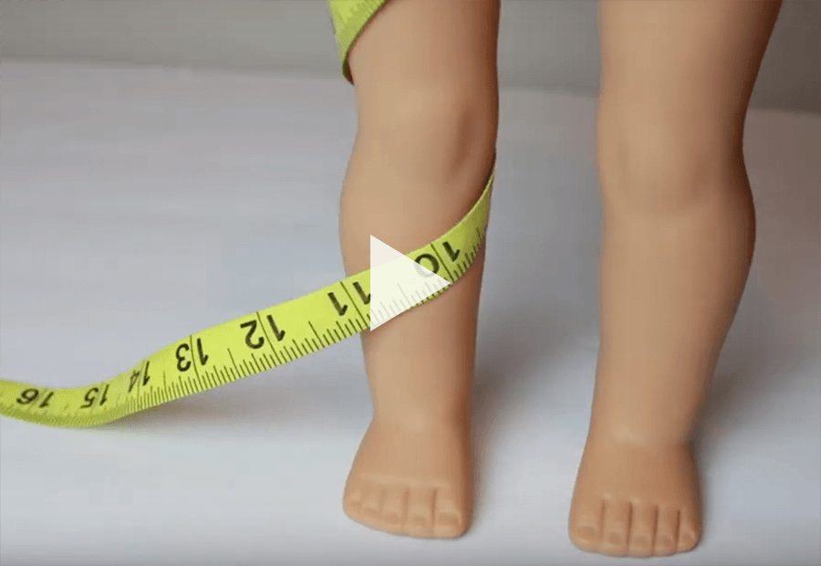 doll leg wrapped with a measuring type